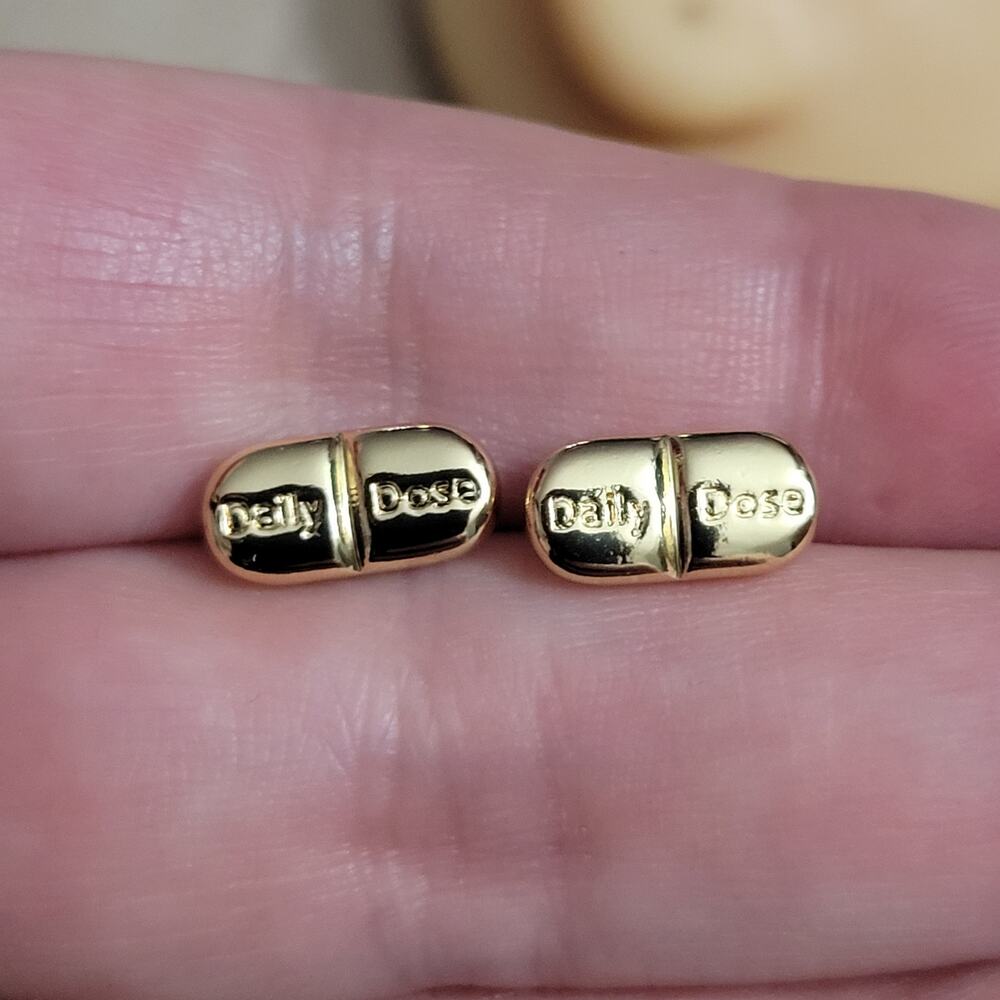 "Daily Dose" pill shaped gold tone post earrings